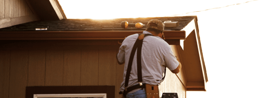 Man installing gutter system